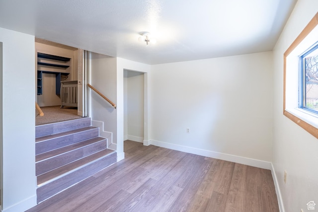 481 W Oak Crest Dr, Monticello, UT 84535 - spare room with wood finished floors and stairway