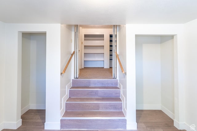 481 W Oak Crest Dr, Monticello, UT 84535 - stairs featuring wood finished floors and baseboards