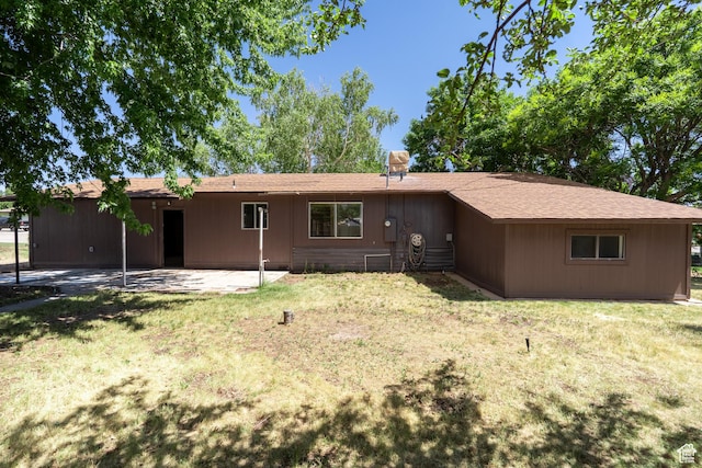 481 W Oak Crest Dr, Monticello, UT 84535 - back of house featuring a patio and a lawn