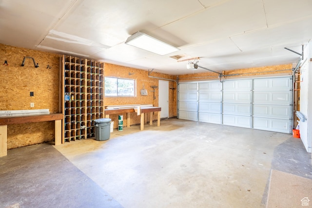 481 W Oak Crest Dr, Monticello, UT 84535 - garage featuring a workshop area and a garage door opener