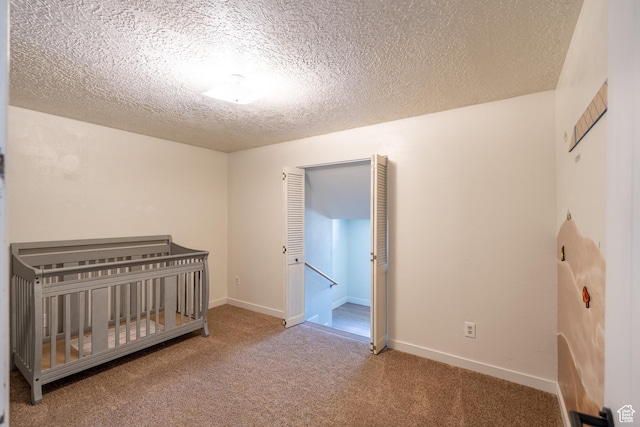 481 W Oak Crest Dr, Monticello, UT 84535 - unfurnished bedroom with carpet floors and a textured ceiling