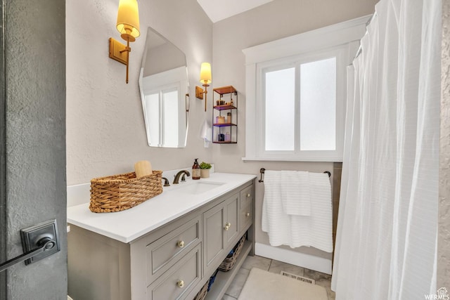 554 17th St, Ogden, UT 84404 - bathroom with vanity and a textured wall