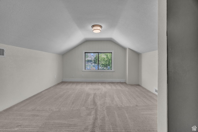 554 17th St, Ogden, UT 84404 - bonus room with vaulted ceiling, a textured ceiling, and carpet floors