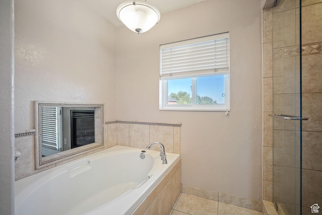 967 E Eaglewood Dr, North Salt Lake, UT 84054 - full bath featuring a bath, tile patterned floors, tiled shower, and a fireplace