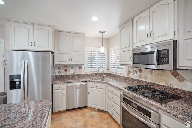967 E Eaglewood Dr, North Salt Lake, UT 84054 - kitchen with appliances with stainless steel finishes, recessed lighting, decorative backsplash, and white cabinets