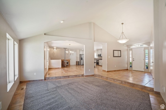 967 E Eaglewood Dr, North Salt Lake, UT 84054 - foyer entrance with arched walkways, light tile patterned floors, and vaulted ceiling
