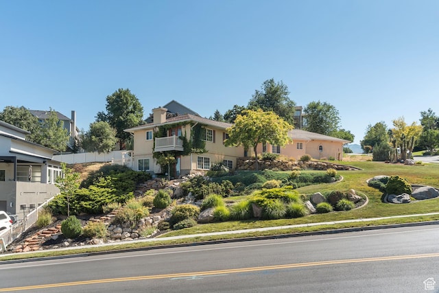 967 E Eaglewood Dr, North Salt Lake, UT 84054 - view of front of house featuring a balcony and stucco siding