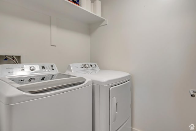 230 E Broadway Unit 401, Salt Lake City, UT 84111 - laundry room featuring washer and dryer