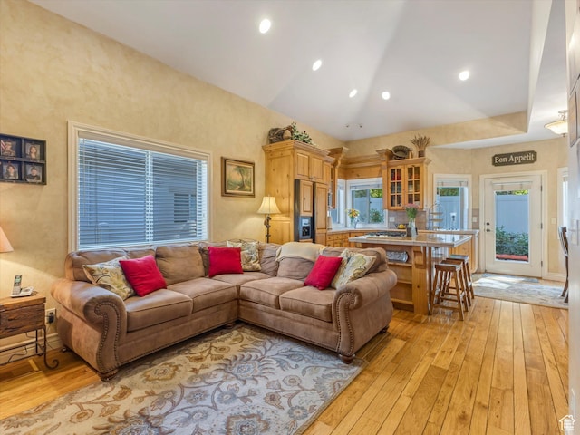 1832 E Cottonwood Glen Ct, Salt Lake City, UT 84117 - living area with light wood-style flooring and vaulted ceiling