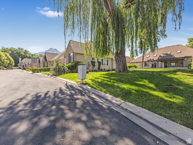 1832 E Cottonwood Glen Ct, Salt Lake City, UT 84117 - view of front of home with a front lawn and a residential view