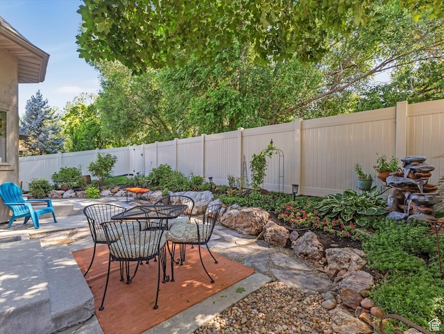 1832 E Cottonwood Glen Ct, Salt Lake City, UT 84117 - fenced backyard with a patio and outdoor dining area