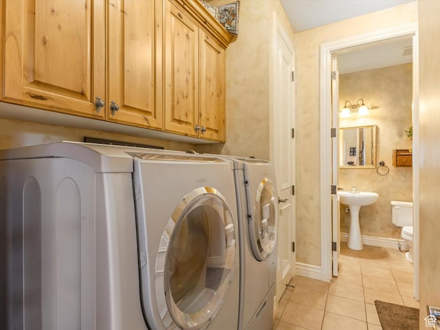1832 E Cottonwood Glen Ct, Salt Lake City, UT 84117 - laundry room featuring washing machine and dryer, light tile patterned floors, and cabinet space