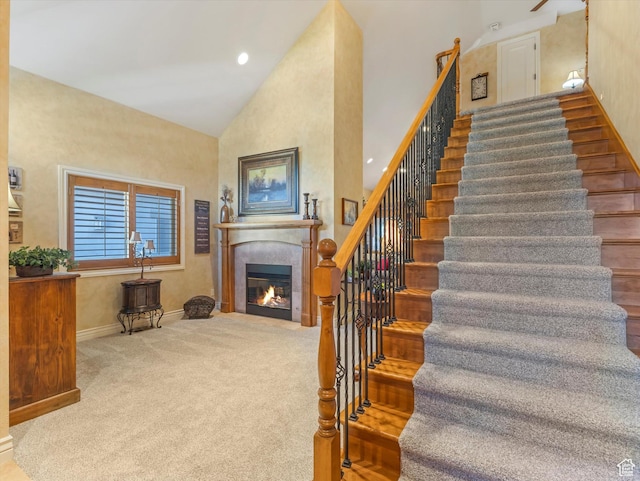 1832 E Cottonwood Glen Ct, Salt Lake City, UT 84117 - stairs featuring a glass covered fireplace, high vaulted ceiling, and carpet floors