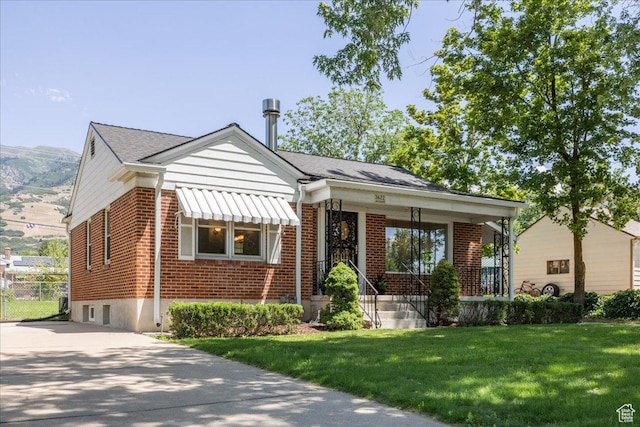 3622 Jackson Ave, Ogden, UT 84403 - bungalow with brick siding and a front lawn