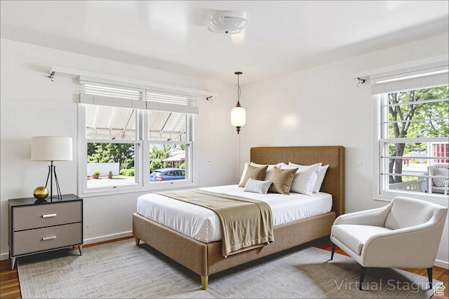 3622 Jackson Ave, Ogden, UT 84403 - bedroom featuring wood finished floors and baseboards