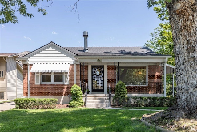 3622 Jackson Ave, Ogden, UT 84403 - view of front of property with brick siding and a front lawn