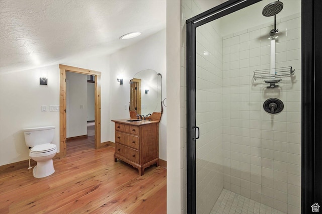 8817 E Mountain Valley Dr S, Huntsville, UT 84317 - full bathroom featuring a stall shower, hardwood / wood-style flooring, vanity, a textured ceiling, and lofted ceiling