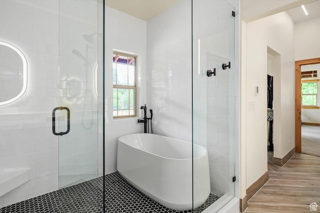 8817 E Mountain Valley Dr S, Huntsville, UT 84317 - full bathroom featuring wood finished floors, a stall shower, and a soaking tub