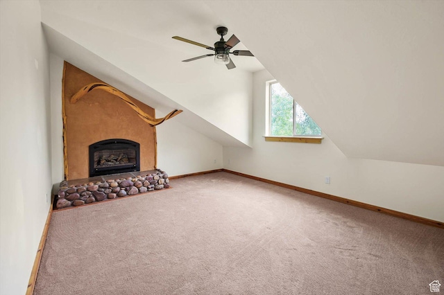 8817 E Mountain Valley Dr S, Huntsville, UT 84317 - unfurnished living room featuring carpet, ceiling fan, vaulted ceiling, and a fireplace with raised hearth