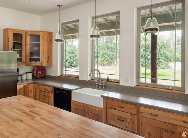 8817 E Mountain Valley Dr S, Huntsville, UT 84317 - kitchen with black dishwasher, butcher block countertops, glass insert cabinets, and plenty of natural light