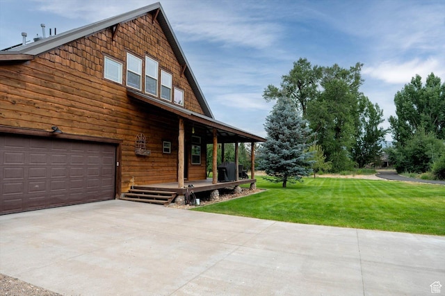8817 E Mountain Valley Dr S, Huntsville, UT 84317 - view of side of home with a garage, a yard, concrete driveway, and a porch