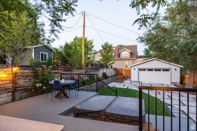 334 N C St, Salt Lake City, UT 84103 - wooden deck with a garage, an outbuilding, a fenced backyard, and outdoor dining space