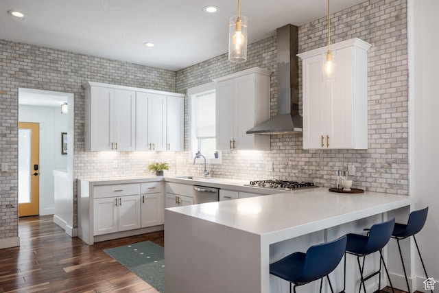 334 N C St, Salt Lake City, UT 84103 - kitchen with appliances with stainless steel finishes, white cabinetry, a peninsula, dark wood-style floors, and recessed lighting