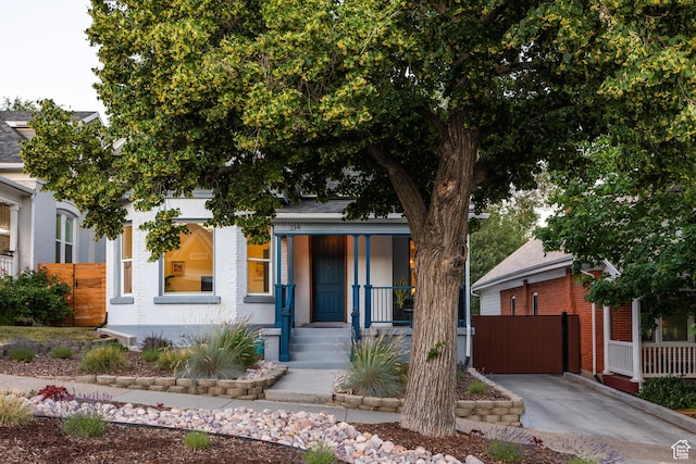 334 N C St, Salt Lake City, UT 84103 - view of front of home with a porch and brick siding