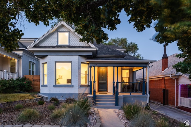 334 N C St, Salt Lake City, UT 84103 - view of front facade with a porch and brick siding