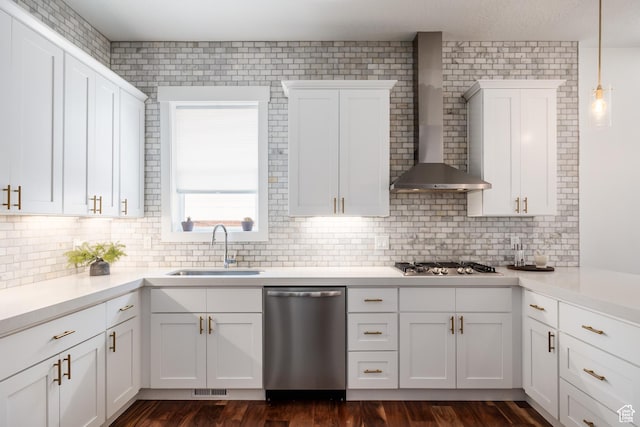 334 N C St, Salt Lake City, UT 84103 - kitchen featuring stainless steel appliances, wall chimney exhaust hood, backsplash, and light countertops