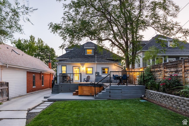 334 N C St, Salt Lake City, UT 84103 - back of house with a hot tub and a wooden deck
