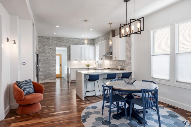 334 N C St, Salt Lake City, UT 84103 - dining room featuring dark wood-type flooring and recessed lighting