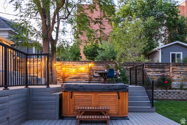 334 N C St, Salt Lake City, UT 84103 - deck featuring a hot tub, a fenced backyard, and stairway