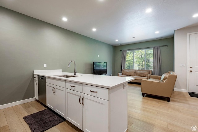 3230 W 3855 S, West Haven, UT 84401 - kitchen with a peninsula, light wood-style flooring, light countertops, white cabinetry, and dishwasher