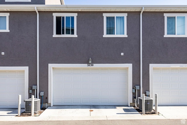 3230 W 3855 S, West Haven, UT 84401 - rear view of house with an attached garage and stucco siding