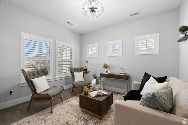 6523 W Bridge Maple Ln S, West Jordan, UT 84081 - sitting room with carpet flooring and a chandelier