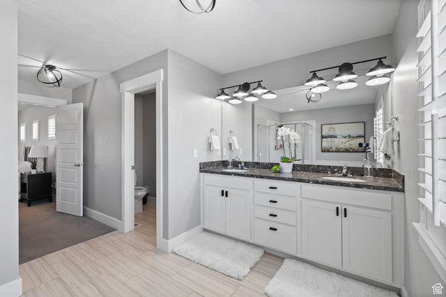 6523 W Bridge Maple Ln S, West Jordan, UT 84081 - bathroom featuring double vanity, ensuite bath, and a shower