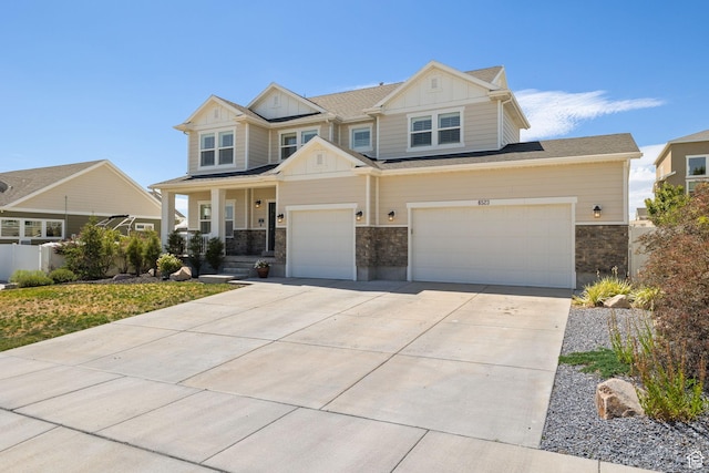 6523 W Bridge Maple Ln S, West Jordan, UT 84081 - craftsman inspired home featuring board and batten siding, driveway, stone siding, a porch, and an attached garage