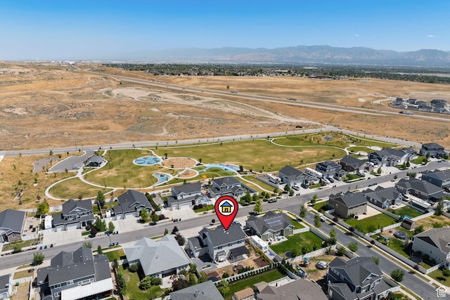 6523 W Bridge Maple Ln S, West Jordan, UT 84081 - aerial view of property and surrounding area with a mountainous background and nearby suburban area