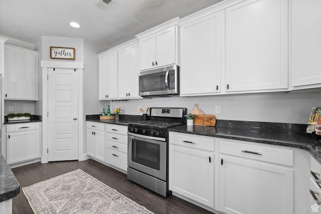 6523 W Bridge Maple Ln S, West Jordan, UT 84081 - kitchen with stainless steel appliances, dark wood-style flooring, white cabinetry, a textured ceiling, and recessed lighting