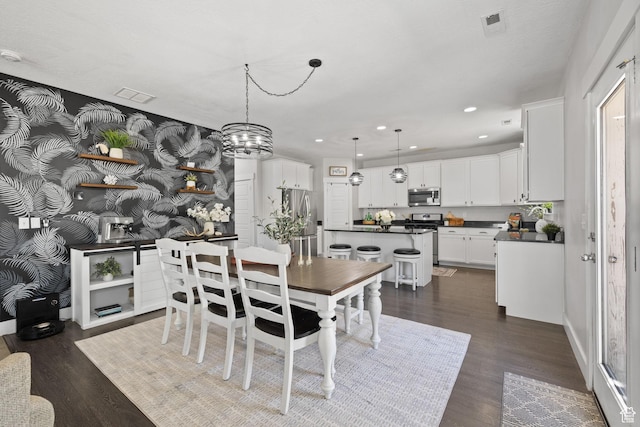 6523 W Bridge Maple Ln S, West Jordan, UT 84081 - dining area with recessed lighting, dark wood-style flooring, and a chandelier
