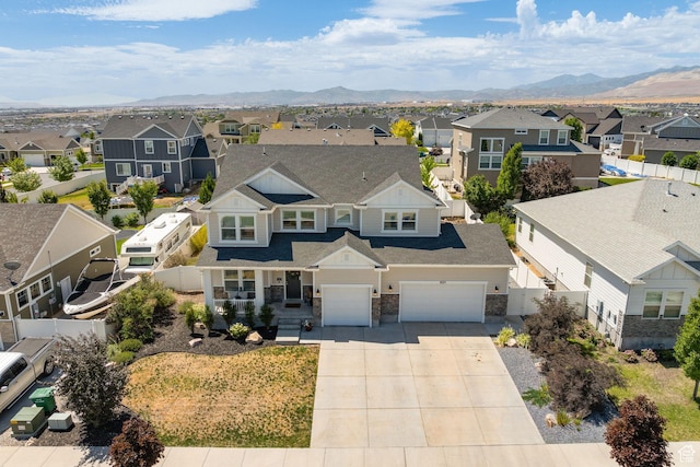 6523 W Bridge Maple Ln S, West Jordan, UT 84081 - aerial view of residential area with a mountainous background