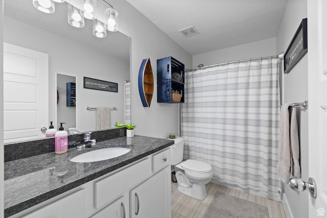 6523 W Bridge Maple Ln S, West Jordan, UT 84081 - bathroom with vanity, wood finished floors, a textured ceiling, and a shower with shower curtain