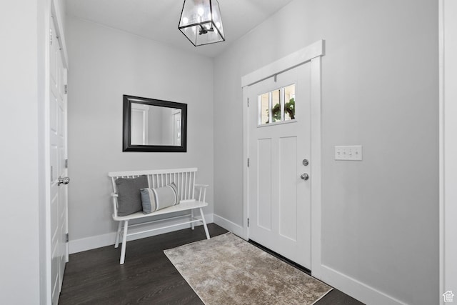 6523 W Bridge Maple Ln S, West Jordan, UT 84081 - foyer entrance featuring dark wood-type flooring and baseboards