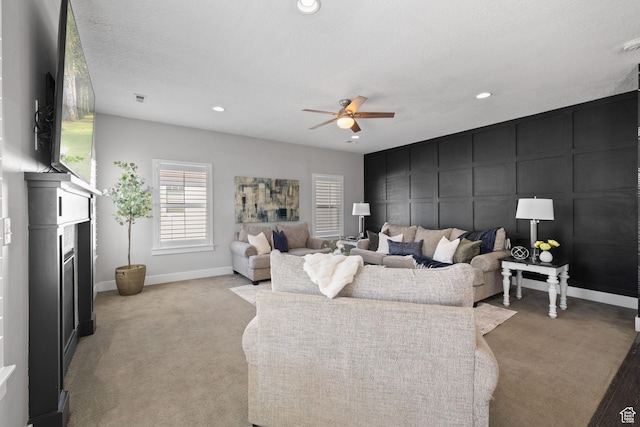 6523 W Bridge Maple Ln S, West Jordan, UT 84081 - living room featuring light colored carpet, a ceiling fan, recessed lighting, and a glass covered fireplace