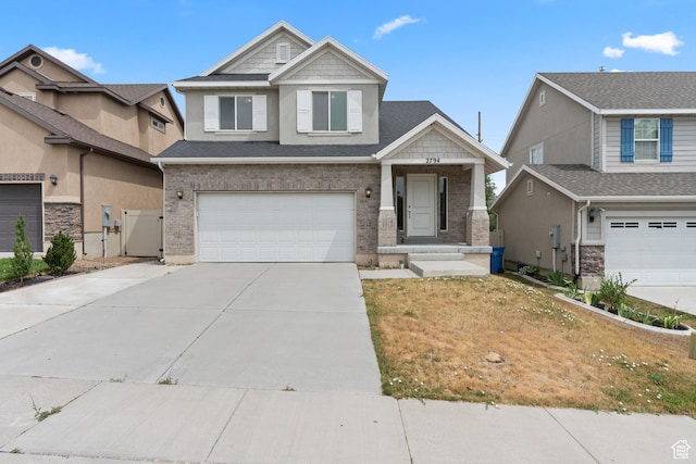 2794 W Harker Ridge Cv, Salt Lake City, UT 84129 - craftsman-style home featuring an attached garage, driveway, brick siding, a gate, and a front yard