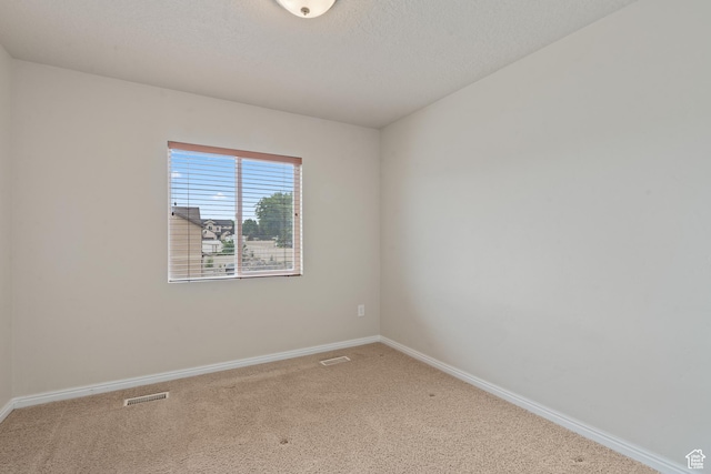2794 W Harker Ridge Cv, Salt Lake City, UT 84129 - unfurnished room with carpet floors and a textured ceiling