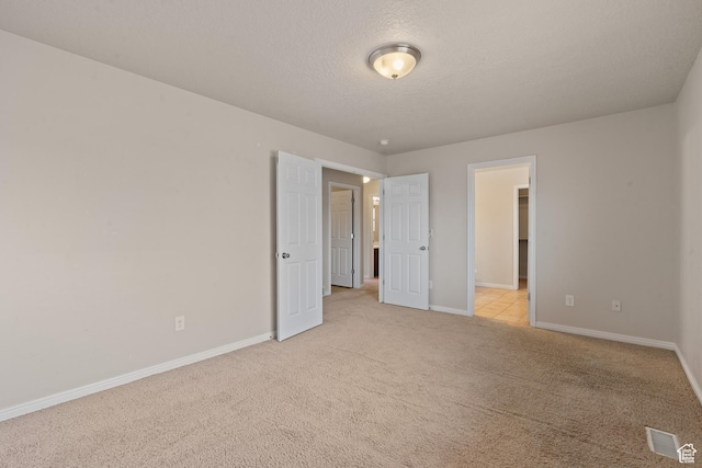 2794 W Harker Ridge Cv, Salt Lake City, UT 84129 - unfurnished bedroom featuring light colored carpet and a textured ceiling