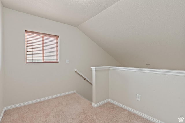 2794 W Harker Ridge Cv, Salt Lake City, UT 84129 - bonus room with vaulted ceiling, carpet floors, and a textured ceiling