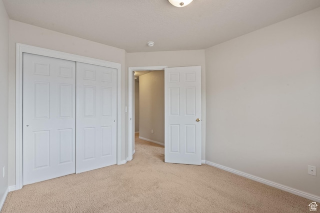 2794 W Harker Ridge Cv, Salt Lake City, UT 84129 - unfurnished bedroom featuring light carpet and a closet